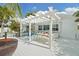 Enjoy outdoor dining under the pergola on the spacious deck, complete with grill and seating at 6446 Lake Sunrise Dr, Apollo Beach, FL 33572