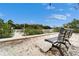 Bench offers a peaceful view of the canal and surrounding greenery at 10608 Hatteras Dr, Tampa, FL 33615