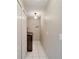 Hallway with a laundry closet that has a washer and dryer at 10608 Hatteras Dr, Tampa, FL 33615