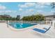Inviting community pool with lounge chairs, perfect for relaxation and enjoying the Florida sunshine at 11200 102Nd Ave # 125, Seminole, FL 33778