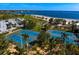 Expansive aerial view of tennis courts with nearby beach and ocean at 1200 N Shore Ne Dr # 204, St Petersburg, FL 33701