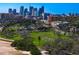 Expansive aerial view featuring city skyline, lush green park, and nearby residential buildings at 1200 N Shore Ne Dr # 204, St Petersburg, FL 33701