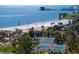 Amazing aerial view highlighting white sandy beach, palm trees, and tennis courts at 1200 N Shore Ne Dr # 204, St Petersburg, FL 33701