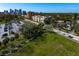 Wide aerial view showcases lush green spaces, tree lined streets, and city skyline at 1200 N Shore Ne Dr # 204, St Petersburg, FL 33701