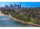 Beautiful aerial shot featuring a scenic waterfront, green spaces, and a vibrant city skyline in the distance at 1200 N Shore Ne Dr # 204, St Petersburg, FL 33701
