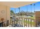 Balcony with seating and views of the tropical landscape at 1200 N Shore Ne Dr # 204, St Petersburg, FL 33701