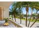 Cozy balcony with seating area overlooking lush greenery and tennis courts at 1200 N Shore Ne Dr # 204, St Petersburg, FL 33701