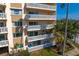 Exterior view showcasing pristine balconies and mature palm trees at 1200 N Shore Ne Dr # 204, St Petersburg, FL 33701