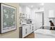 Modern kitchen featuring sleek white cabinets, stainless steel appliances, and stylish decor at 1200 N Shore Ne Dr # 204, St Petersburg, FL 33701