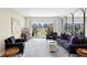 Bright living room features comfortable seating, large windows, and access to outdoor patio area at 1200 N Shore Ne Dr # 204, St Petersburg, FL 33701