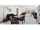 Cozy living and dining space with comfortable seating and access to a sunlit outdoor area at 1200 N Shore Ne Dr # 204, St Petersburg, FL 33701