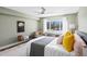 Serene bedroom with a fan, a window, and a cozy sitting area, offering a relaxing retreat at 1200 N Shore Ne Dr # 204, St Petersburg, FL 33701