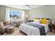 Well-lit bedroom features a fan, a window, a desk, and a cozy sitting area at 1200 N Shore Ne Dr # 204, St Petersburg, FL 33701