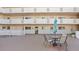 Inviting outdoor patio with table and chairs, perfect for relaxing in this multi-story building at 1200 N Shore Ne Dr # 204, St Petersburg, FL 33701