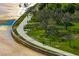 Aerial view of a walking path along the water, with trees and green space at 1200 N Shore Ne Dr # 204, St Petersburg, FL 33701