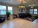 Spacious living room featuring tile floors, ample natural light, and stylish decor at 13359 Orca Sound Dr, Riverview, FL 33579