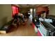 View of a cluttered living room with hardwood floors and natural light from the windows at 2120 57Th N Ave, St Petersburg, FL 33714