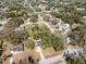 Aerial view of a residential area showing many single-Gathering homes and lush trees in a neighborhood setting at 402 W Jersey Ave, Brandon, FL 33510