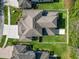 Aerial view of the home showing the roof, backyard, and driveway at 4446 Wildstar Cir, Wesley Chapel, FL 33544