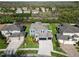 Expansive aerial view of the property showcasing the home's layout and landscaping at 4446 Wildstar Cir, Wesley Chapel, FL 33544