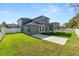 Spacious backyard with green lawn and white fence, perfect for outdoor activities at 4446 Wildstar Cir, Wesley Chapel, FL 33544