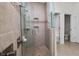 Walk-in shower with tile walls and flooring and a separate toilet room at 4446 Wildstar Cir, Wesley Chapel, FL 33544