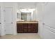 Bathroom featuring double sink with granite countertop, tile flooring, and a walk-in shower at 4446 Wildstar Cir, Wesley Chapel, FL 33544