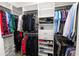 Organized walk-in closet with shelves, drawers, and hanging rods at 4446 Wildstar Cir, Wesley Chapel, FL 33544