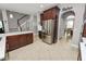 An open-concept kitchen boasts stainless steel appliances, rich cabinetry, and an inviting breakfast area at 4446 Wildstar Cir, Wesley Chapel, FL 33544