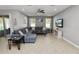 Spacious living room with neutral walls, comfortable seating, and stylish decor at 4446 Wildstar Cir, Wesley Chapel, FL 33544