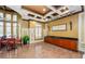 Well-decorated lobby area with decorative ceiling, wainscoting, and built-in storage at 4446 Wildstar Cir, Wesley Chapel, FL 33544