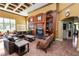 Cozy resident lounge with leather sofas, a fireplace, and built-in shelving at 4446 Wildstar Cir, Wesley Chapel, FL 33544