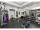Well-equipped weight room with multiple benches, dumbbells, and weight machines at 4446 Wildstar Cir, Wesley Chapel, FL 33544