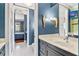 Bathroom featuring tile flooring, a modern sink, and an adjoining shower at 5010 W Dickens Ave, Tampa, FL 33629