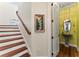 Charming bathroom with an attractive vanity, framed nature painting, and staircase at 5010 W Dickens Ave, Tampa, FL 33629
