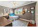 Neutral bedroom with hardwood floors, a comfortable bed, and natural lighting at 5010 W Dickens Ave, Tampa, FL 33629
