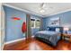 Inviting bedroom features stylish decor, hardwood floors, and plenty of natural light at 5010 W Dickens Ave, Tampa, FL 33629