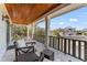 Large, covered patio with comfortable seating and a view of the neighborhood at 5010 W Dickens Ave, Tampa, FL 33629