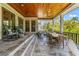Spacious covered patio with an abundance of seating perfect for outdoor dining and entertaining at 5010 W Dickens Ave, Tampa, FL 33629