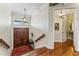 Beautiful foyer showcasing a coffered ceiling, hardwood floors, and a view to the bathroom at 5010 W Dickens Ave, Tampa, FL 33629