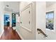 Upstairs hallway with hardwood floors and natural light at 5010 W Dickens Ave, Tampa, FL 33629