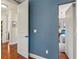 Hallway leading to a bedroom with hardwood floors at 5010 W Dickens Ave, Tampa, FL 33629