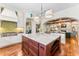 Open kitchen with marble island, modern appliances, and seamless transition to the living spaces at 5010 W Dickens Ave, Tampa, FL 33629