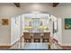 Kitchen view from the living room showcasing the island, white cabinets, and stainless steel appliances at 5010 W Dickens Ave, Tampa, FL 33629