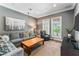 Cozy living room with plush seating, bright windows, and a calming gray color palette at 5010 W Dickens Ave, Tampa, FL 33629