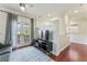Bright living area features French doors, hardwood floors, and a modern entertainment center at 5010 W Dickens Ave, Tampa, FL 33629