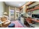 Comfortable home office with large windows, neutral paint, custom built-ins, and designer rug at 5010 W Dickens Ave, Tampa, FL 33629