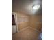 Room features tiled floor, door, and windows with blinds at 11714 Hoyt Ave, Tampa, FL 33617