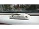 Close-up of a white window latch and sill with a view through the window at 1216 S Missouri Ave # 224, Clearwater, FL 33756