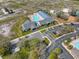 Overhead view of a community pool, recreational facilities, and parking, showcasing a well-maintained and spacious area at 13024 Prestwick Dr, Riverview, FL 33579